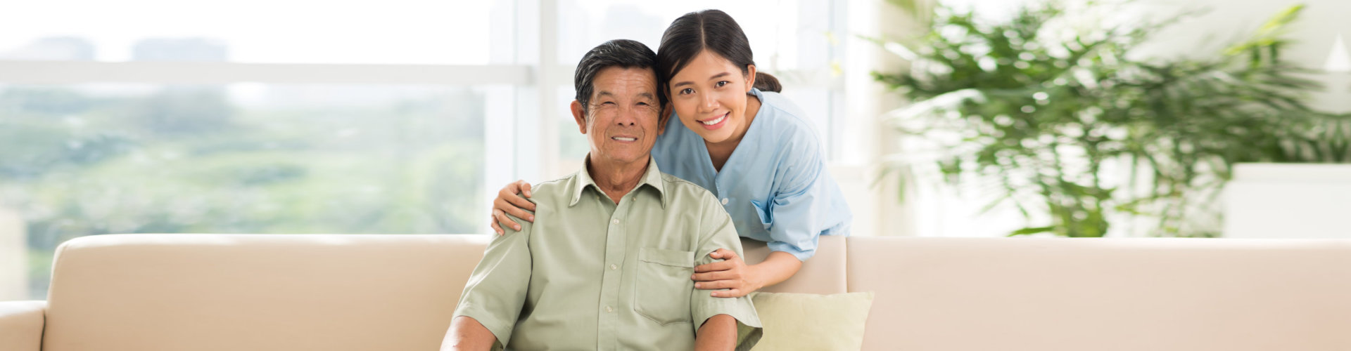 happy caregiver and senior man