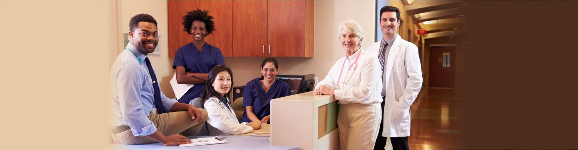 Portrait Of Medical Staff At Nurse s Station In Hospital